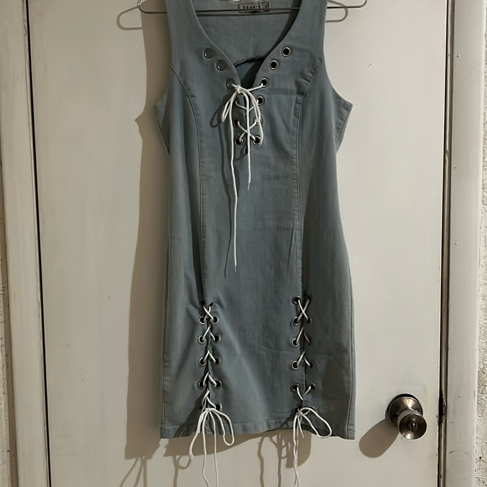 Jean dress with strings to give it a tie look the dress does stretch looks sexy